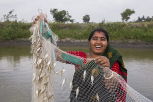 A woman with fish caught using gill net in Bangladesh. Photo by Md. Masudur Rahaman (WorldFish)